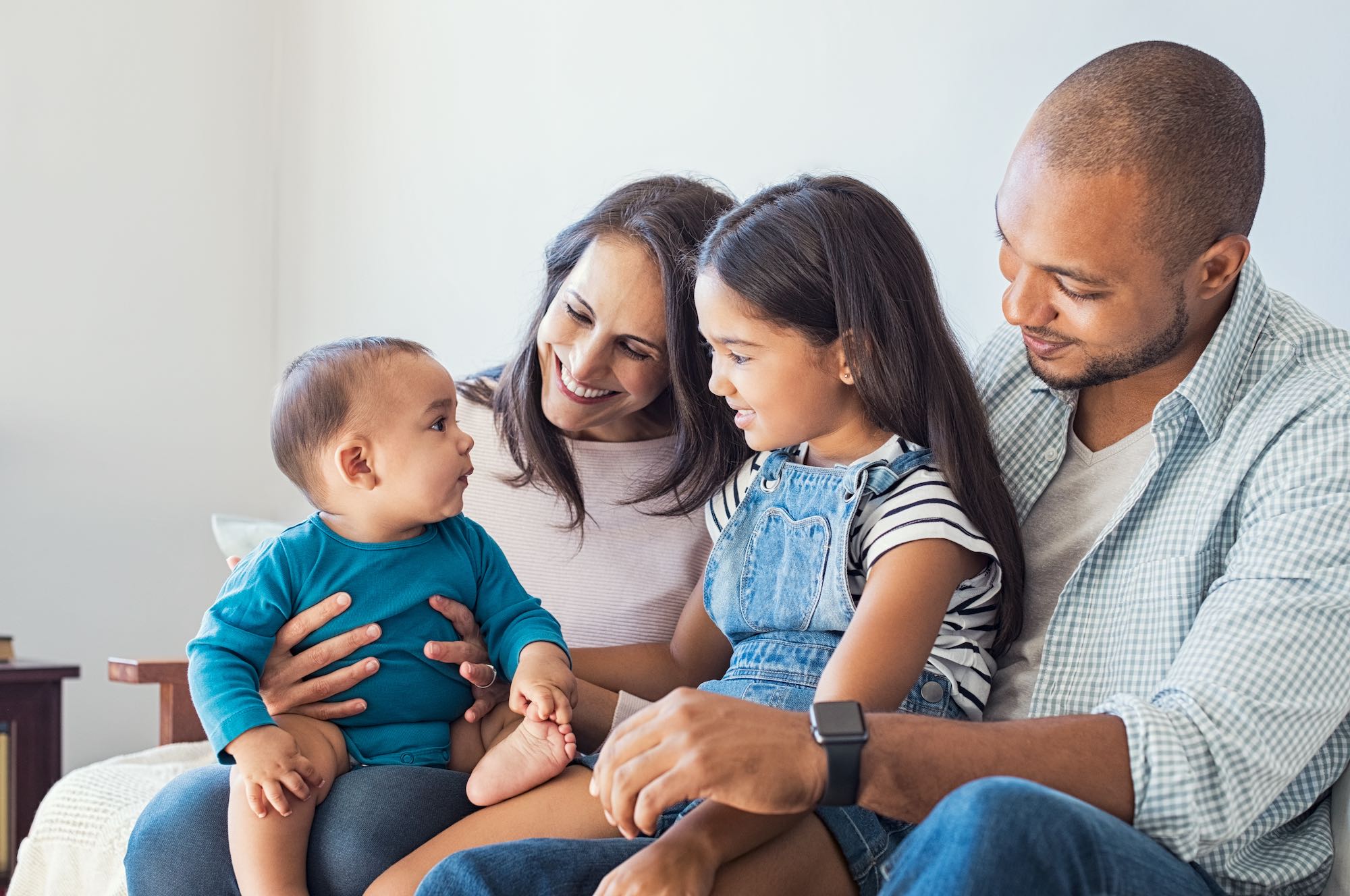 Family playing with baby
